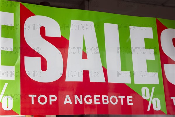 Shop window with sign SALE