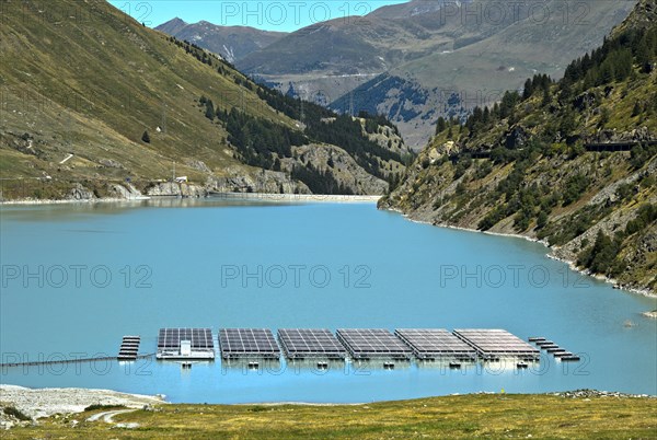 Solar panels floating on the mountain lake Lac des Toules