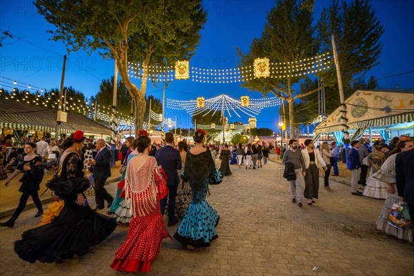 Spanish women with colorful flamenco dresses