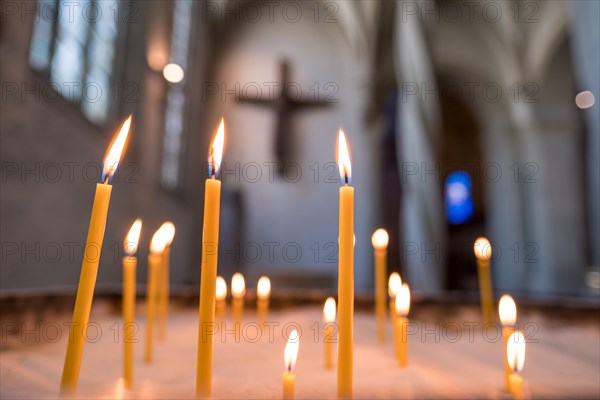 Sacrificial candles in front of the Imervard Cross