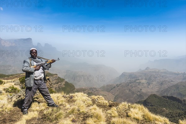 Sentry with rifle in the mountains