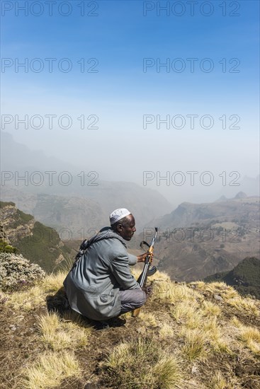 Sentry with rifle in the mountains