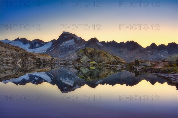 Graetlisee with reflection of the mountains in the morning light