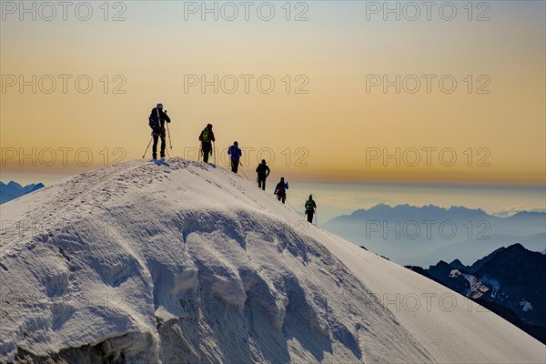 Mountaineer on the summit ridge of the Grossvenediger