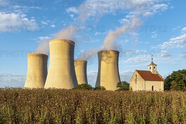 Old abandoned chapel and cooling towers of Dukovany Nuclear Power Station