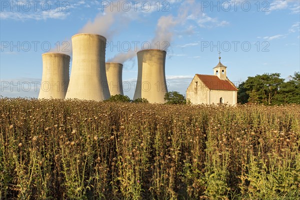 Old abandoned chapel and cooling towers of Dukovany Nuclear Power Station