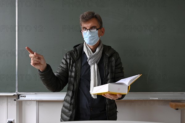 Teacher with thick winter jacket