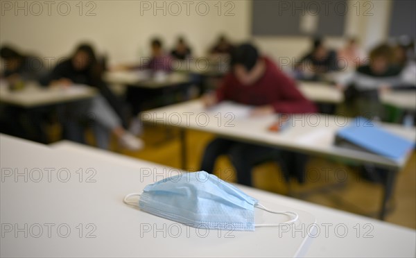 Face mask on student's desk