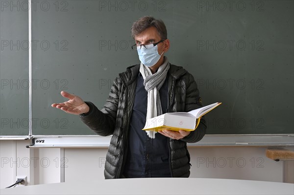 Teacher with thick winter jacket