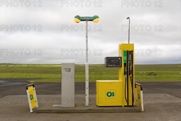 Small remote petrol station with yellow fuel pump