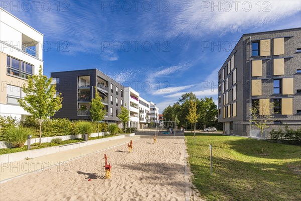 Playground in front of modern apartment building