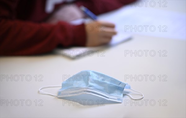 Face mask on student's desk