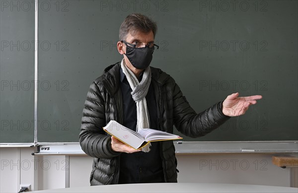 Teacher with thick winter jacket