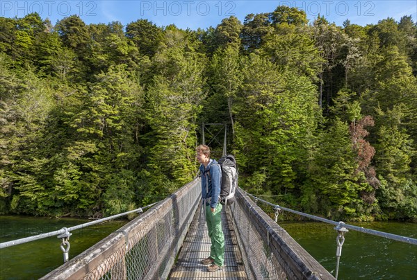 Hiker on suspension bridge