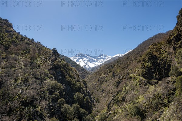 View of snow-covered mountains of the Sierra Nevada with summits Mulhacen and La Alcazaba
