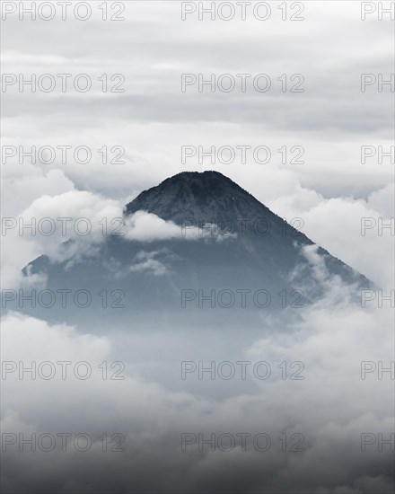 Volcano surrounded by clouds