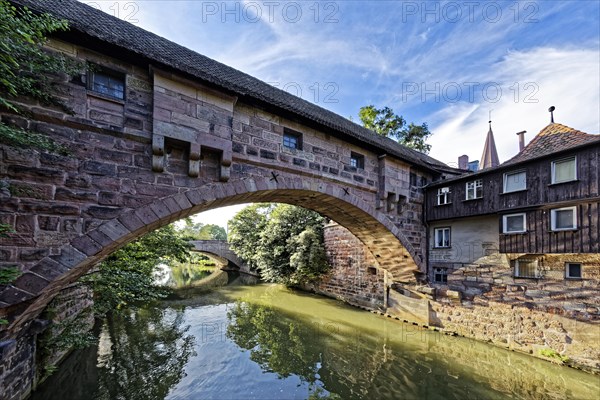 View from Kettensteg to Fronveste and Hallertor bridge over the river Pegnitz