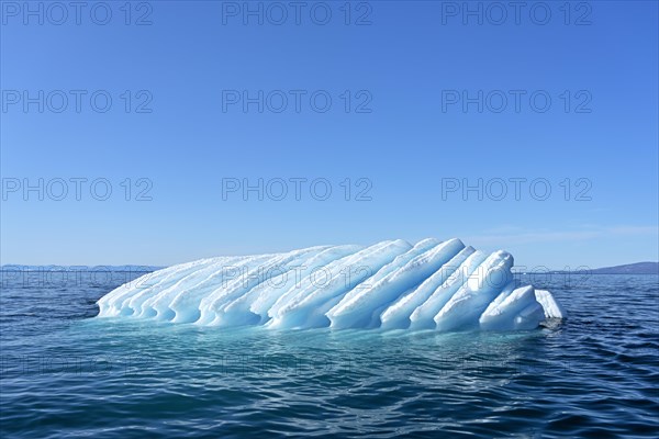 Iceberg drifts through Icefjord