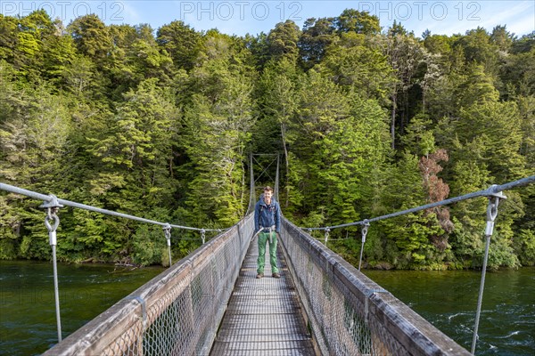 Hiker on suspension bridge