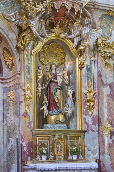 Side altar with figure of the Virgin Mary