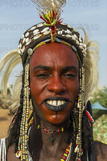 Wodaabe-Bororo man with face painted at the annual Gerewol festival