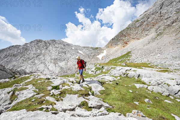 Hiker on hiking trail around the Funtenseetauern