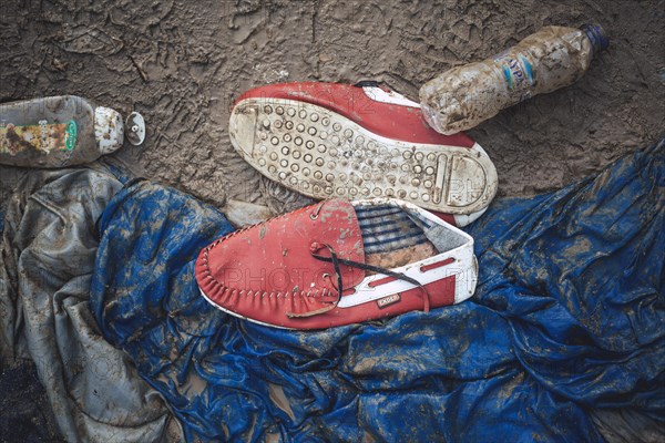 Red moccasins in front of a tent