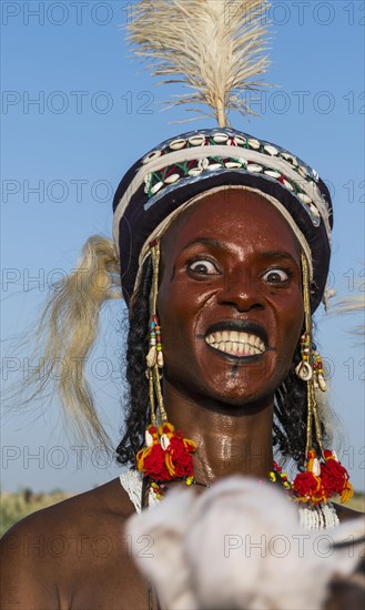 Wodaabe-Bororo man with his face painted at the annual Gerewol festival