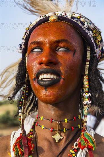 Wodaabe-Bororo man with face painted at the annual Gerewol festival