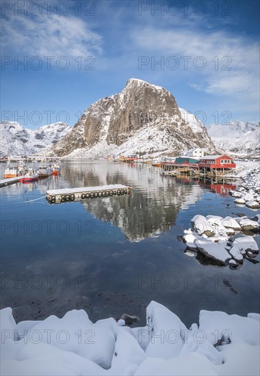 Rorbuer fishermen's cabins on the snowy fjord