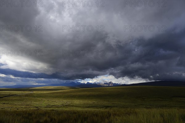 Mountain range of the Cordillera Blanca under dark clouds