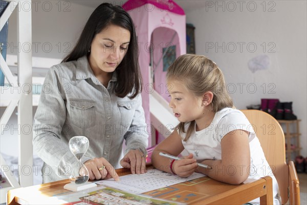 Mother and daughter at homework supervision