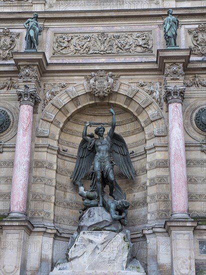Bronze statue of the fountain La Fontaine Saint Michel at Place Saint-Michel