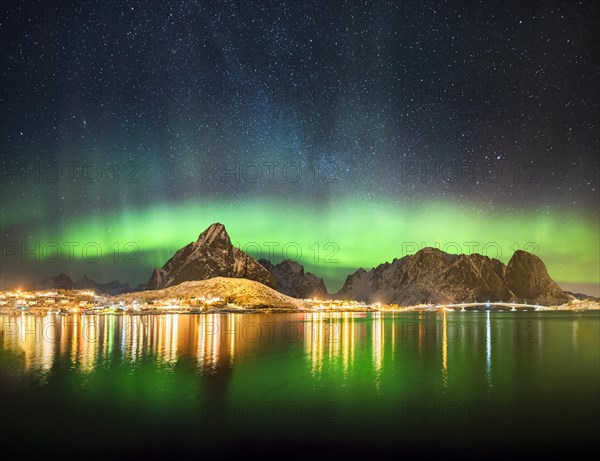 Northern lights at the fjord above the fishing village Reine