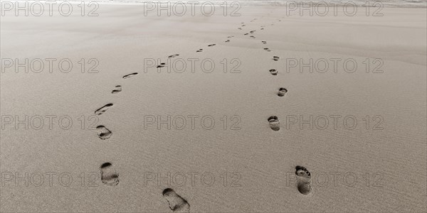 Two footprints in the sand