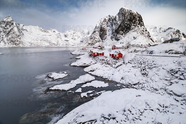 Rorbuer fishermen's cabins on the snowy fjord