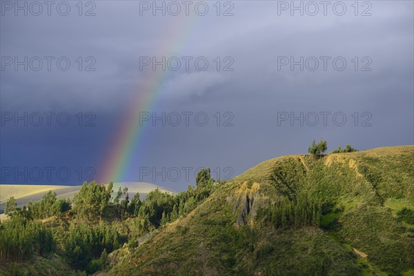 Rainbow in front of dark clouds
