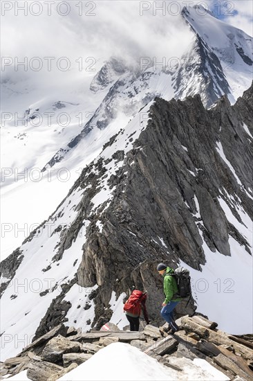 Hiker at the rugged mountain peak