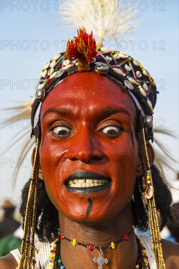 Wodaabe-Bororo man with face painted at the annual Gerewol festival