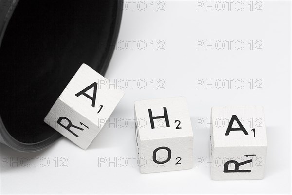 Dice cup with letter cubes