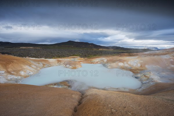 Turquoise lake in the lava river Leihrnjukur in the Krafla