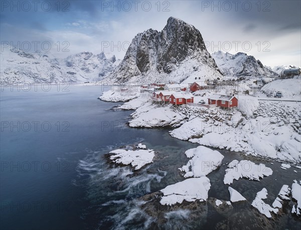 Rorbuer fishermen's cabins on the snowy fjord