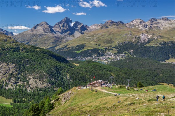 Alp Languard with mountain hut in front of the Inn Valley with St