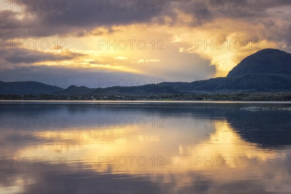 Cloud atmosphere in the evening light at a fjord