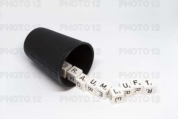 Dice cup with letter cubes