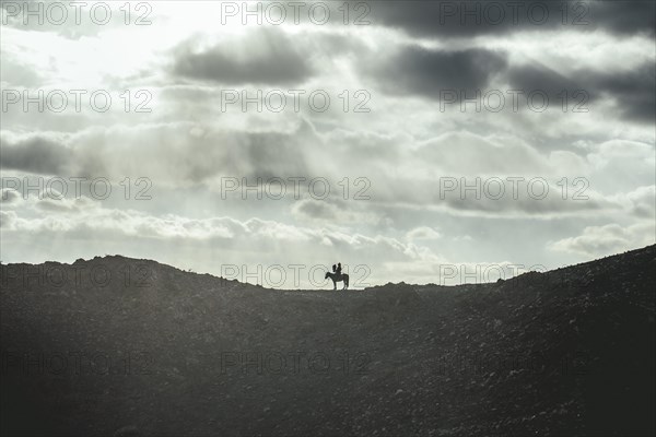 Eagle hunter Bashakhan Spai scouting for prey in the gorges of Kisil Char