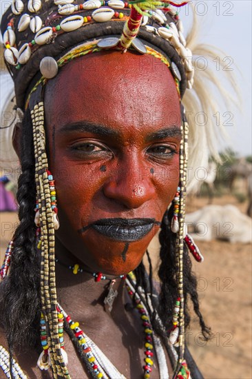 Wodaabe-Bororo man with face painted at the annual Gerewol festival