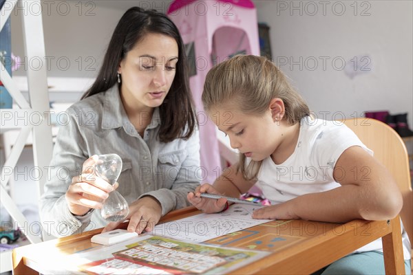 Mother and daughter at homework supervision