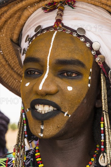 Wodaabe-Bororo man with face painted at the annual Gerewol festival