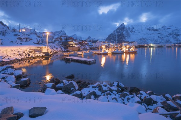 Port of the fishing village Hamnoy Polar Night in winter